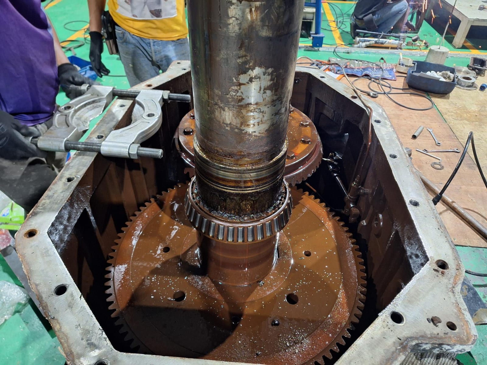 Cooling tower gearbox opened for overhaul in Thailand, showing the bevel ring gear and pinion bearing